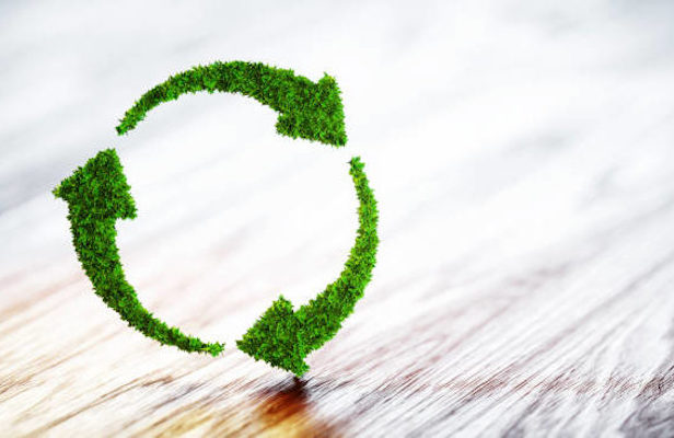 Recycling icon made of grass