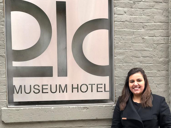 Anushae standing in front of a 21C Museum sign