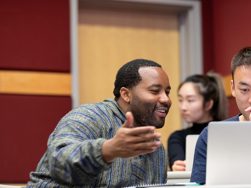 Jeremiah talks to a fellow student