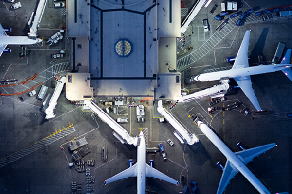 Image of an planes at an aurport terminal.