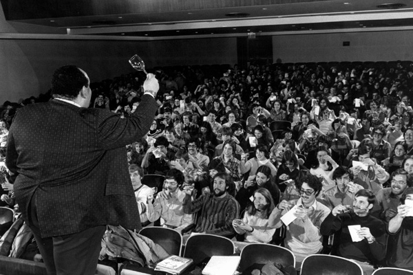 Vance A. Christian raises a glass of wine to 350 students in wine course