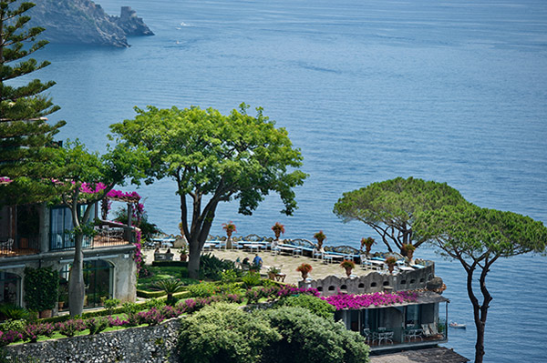 stone terrace and gardens of a hotel overlooking the sea on the Amalfi Coast of Italy.