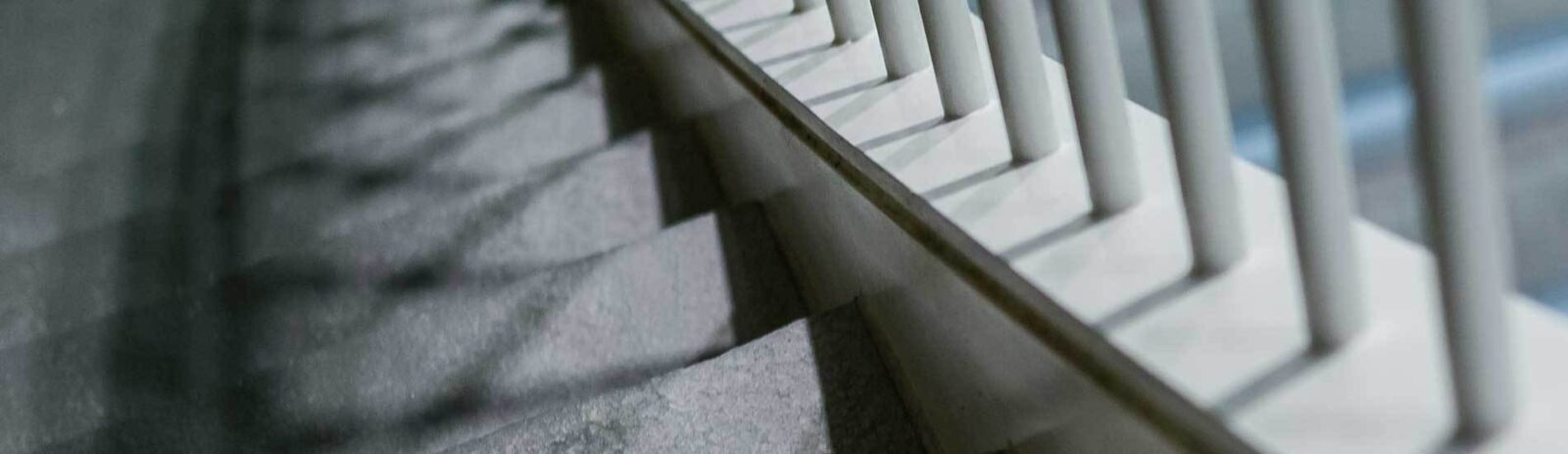 Gray stairs with white columns.