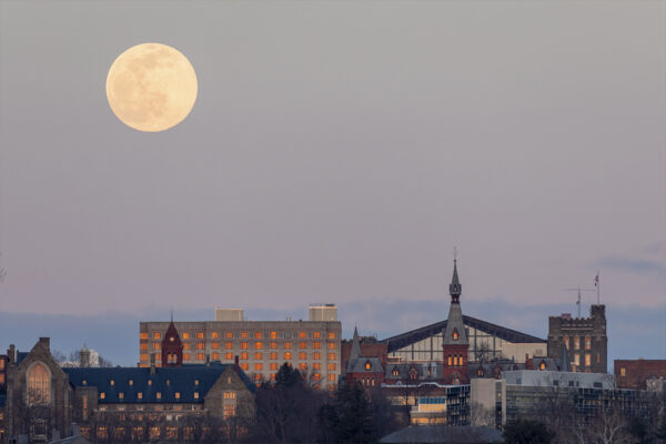 The moon glowing over the Cornell campus.