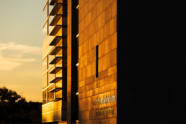 Facade of Statler Hall in the golden hour.