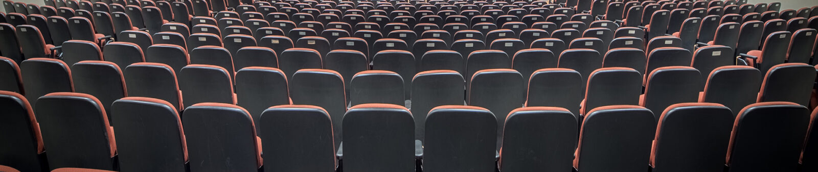 Backs of chairs in an auditorium.