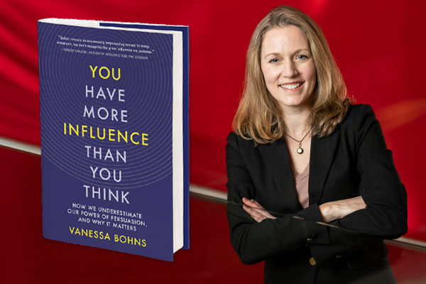 Headshot of Vanessa Bohns, net to an enlarged image of her book, on a red background.
