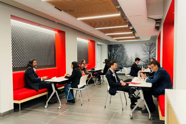 Mentees and mentors meet for 1:1 conversations on family business issues.